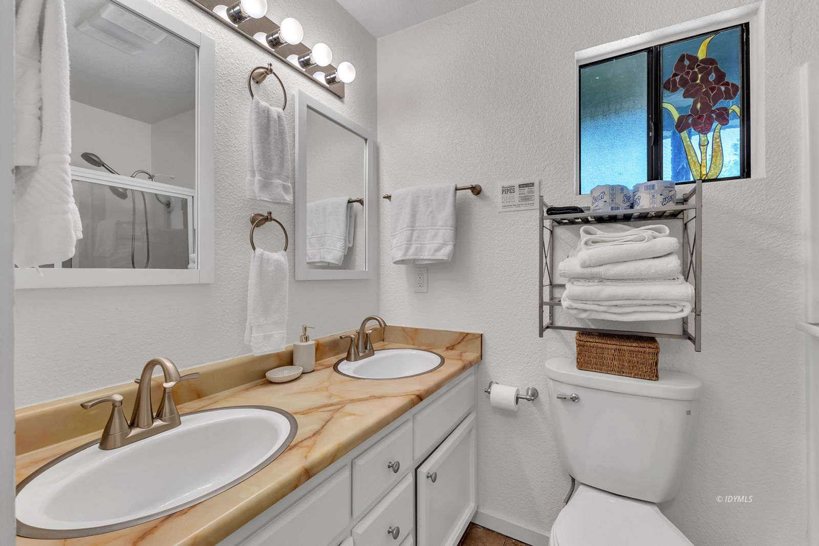 25595 Glen Road Idyllwild, CA 92549 - Photo 43 of 51 a bathroom with a sink a toilet and a mirror