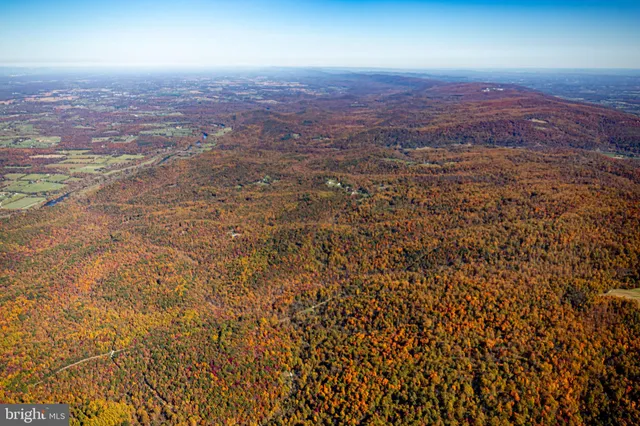 an aerial view of residential house with an outdoor space
