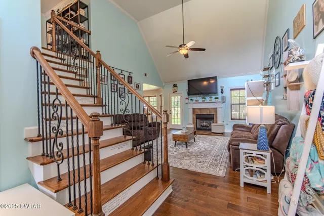 a living room with furniture fireplace and flat screen tv