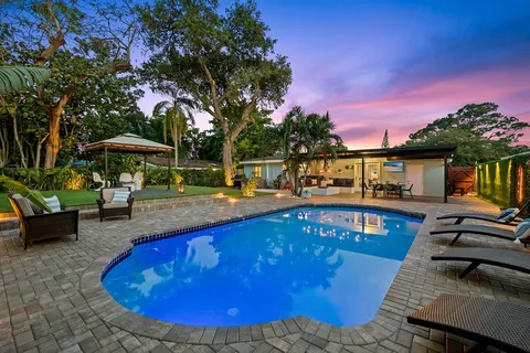 a view of a swimming pool with a patio