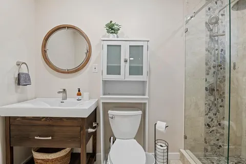 a bathroom with a shower and a sink