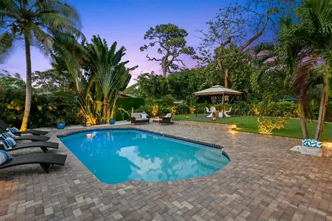 a view of a chair and table under an umbrella