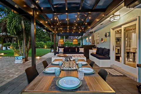 a living room with furniture a rug and a flat screen tv