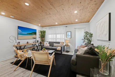 a kitchen with sink a microwave and refrigerator