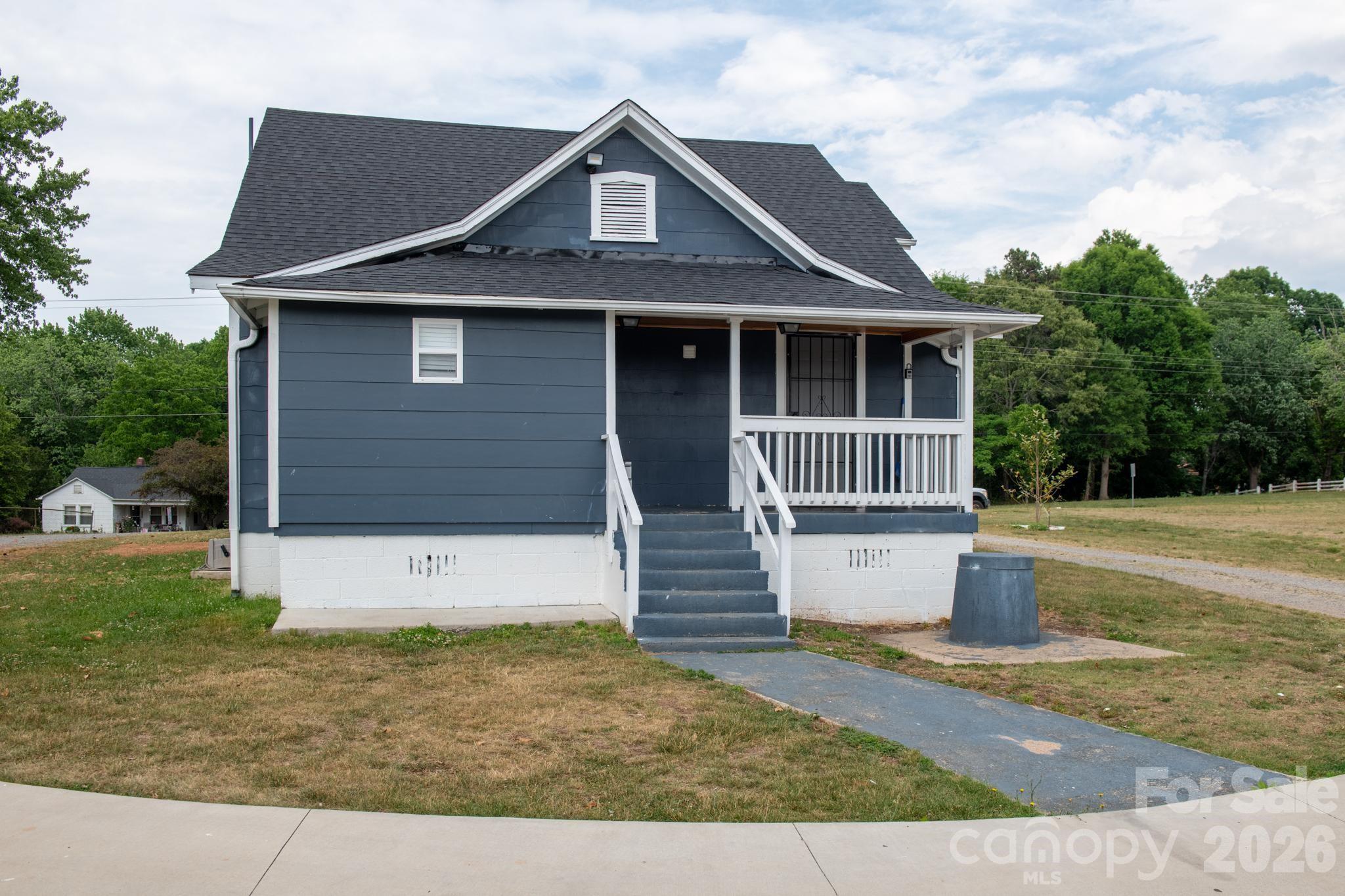 2076 Connelly Springs Road Lenoir, NC 28645 - Photo 45 of 47 a front view of a house with a yard