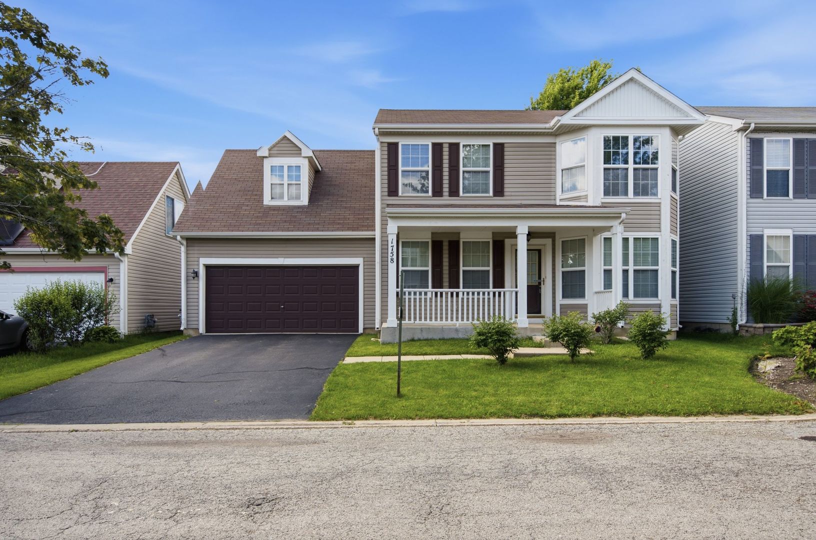 1758 Edith Lane Aurora, IL 60504 - Photo 1 of 28 a front view of a house with a yard