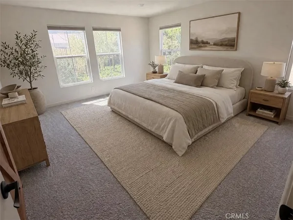 a spacious bedroom with a bed and a large window