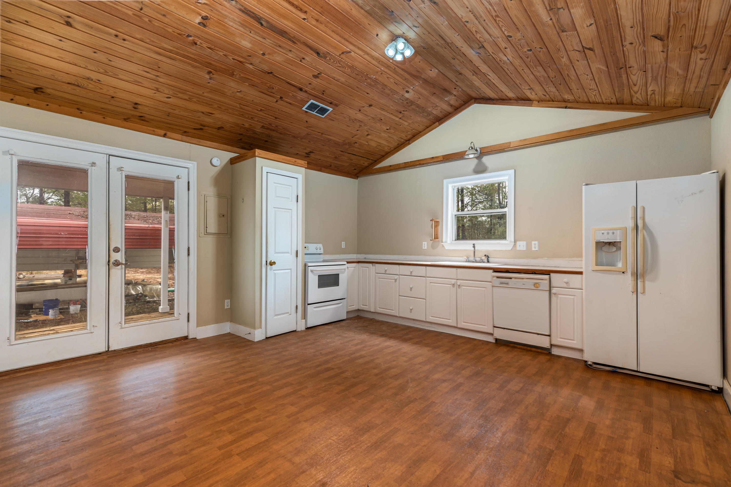1504 Hinote Road DeFuniak Springs, FL 32433 - Photo 1 of 21 a view of a kitchen with refrigerator and cabinet