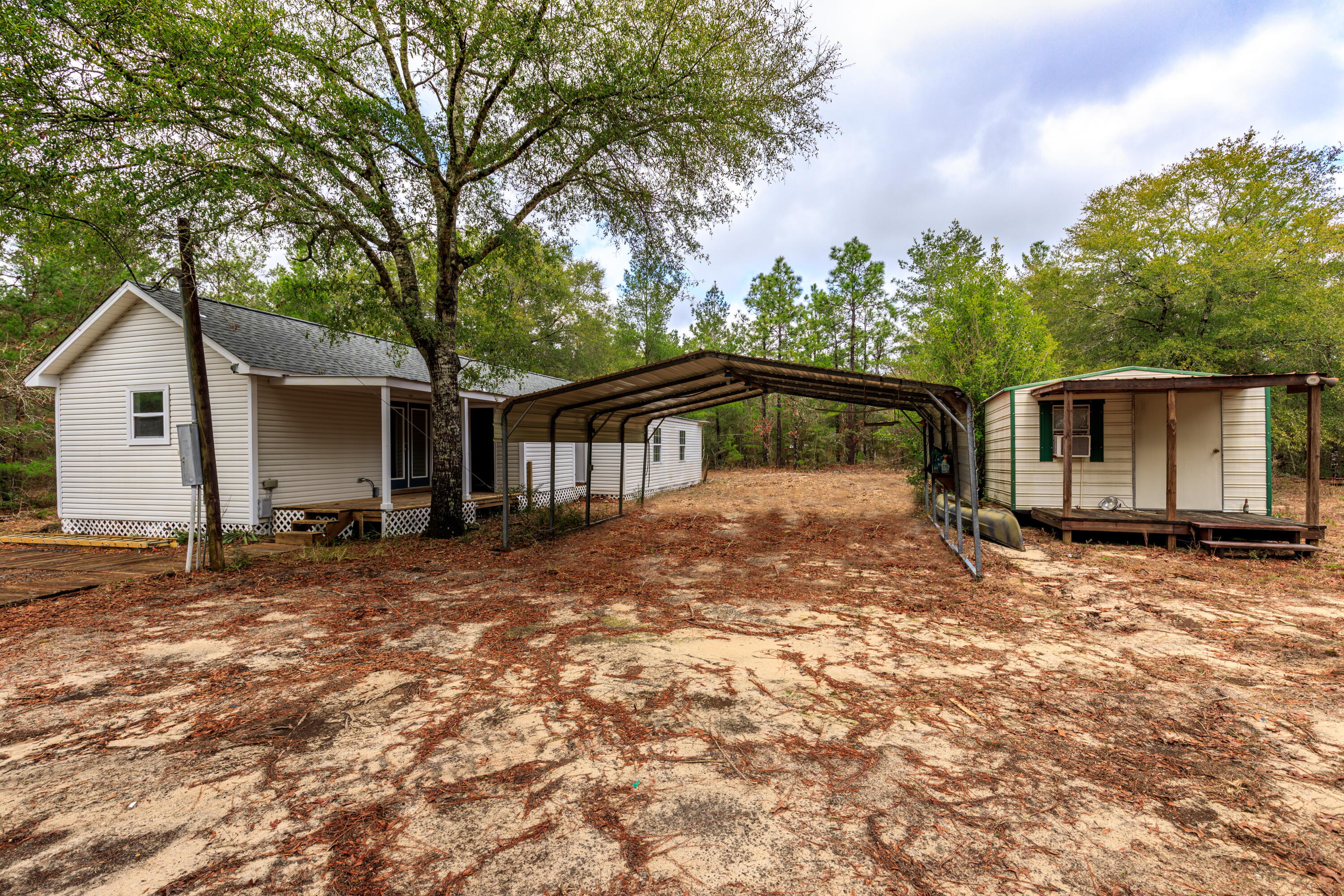 1504 Hinote Road DeFuniak Springs, FL 32433 - Photo 11 of 21 a view of a house with a yard