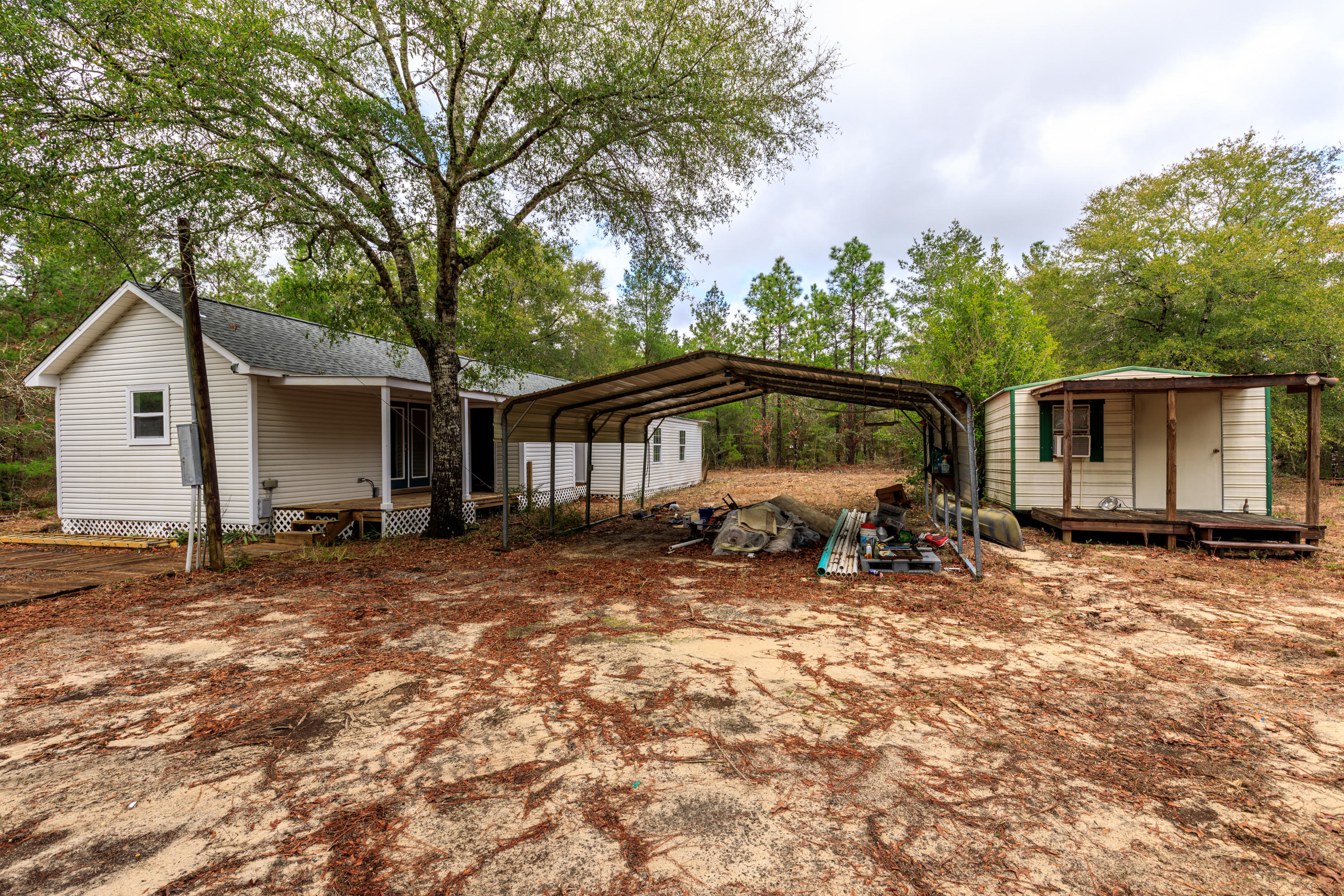 1504 Hinote Road DeFuniak Springs, FL 32433 - Photo 12 of 21 a view of a house with backyard and sitting area