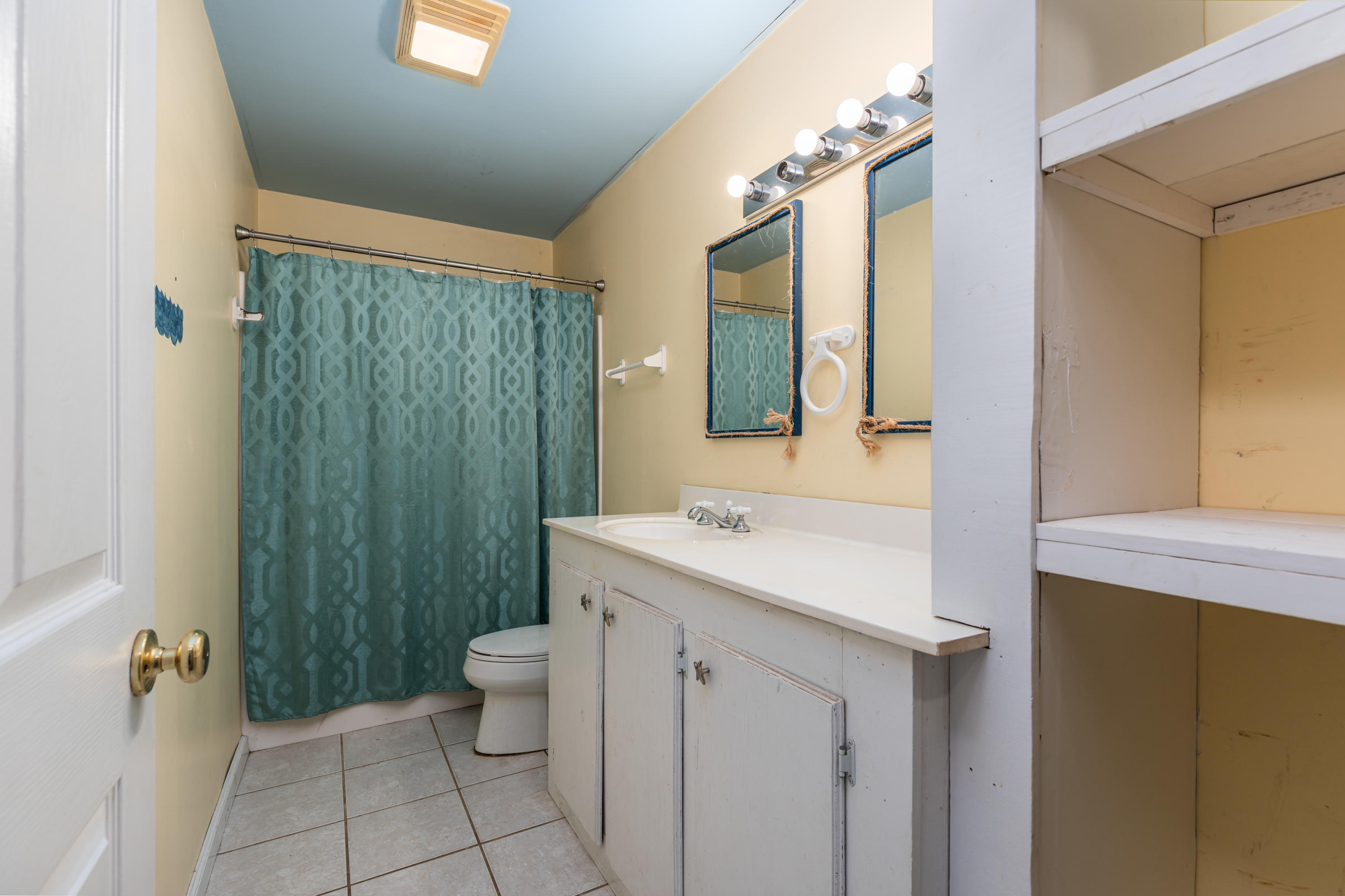1504 Hinote Road DeFuniak Springs, FL 32433 - Photo 16 of 21 a bathroom with a sink a toilet and shower