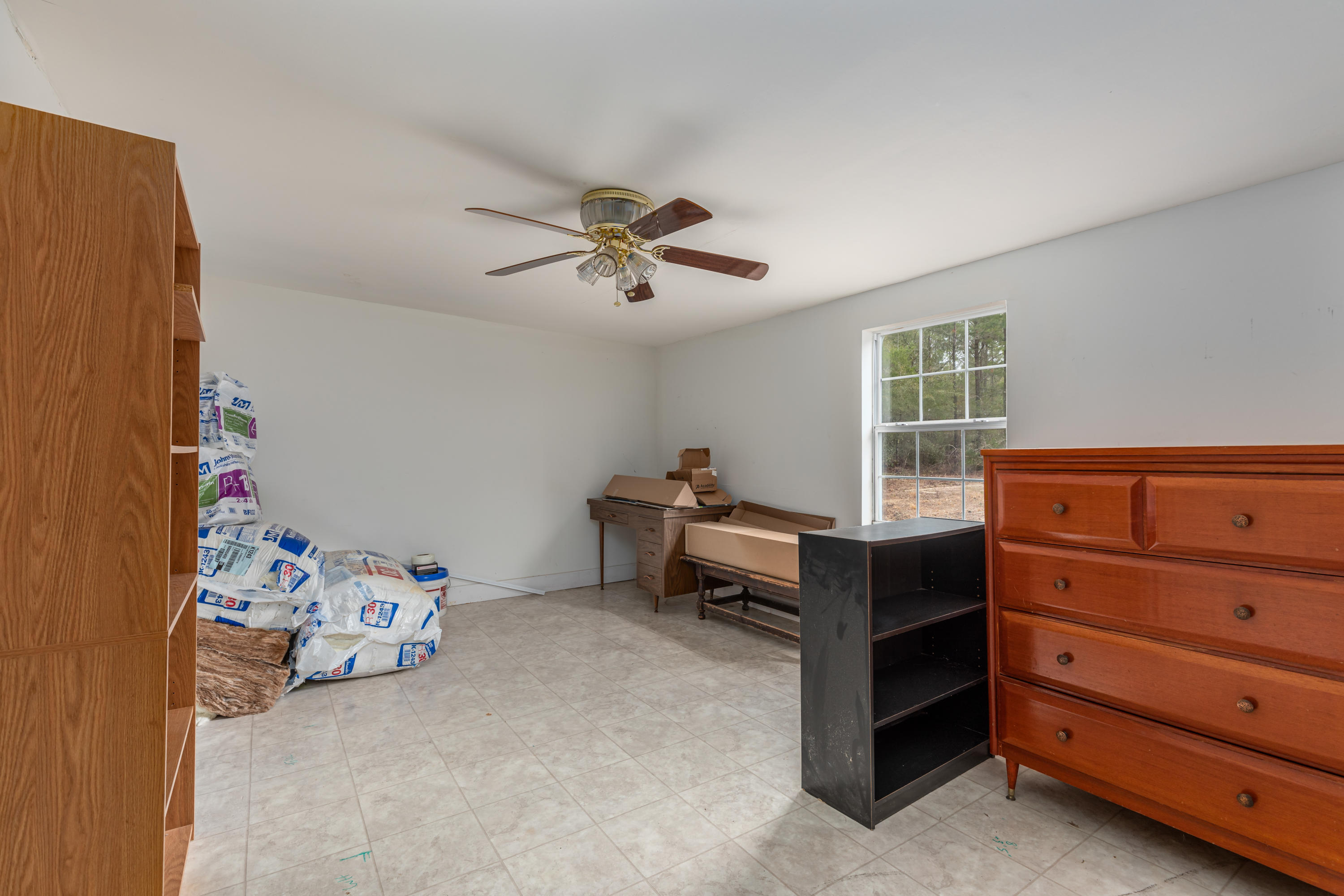 1504 Hinote Road DeFuniak Springs, FL 32433 - Photo 17 of 21 a bed room with a bed and a window