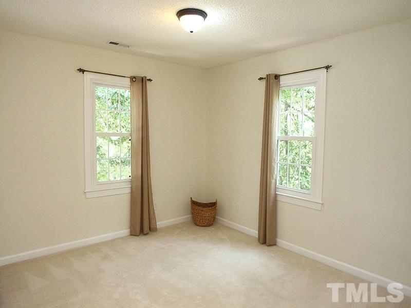 4 Swallows Ridge Court Durham, NC 27713 - Photo 13 of 18 an empty room with windows and closet