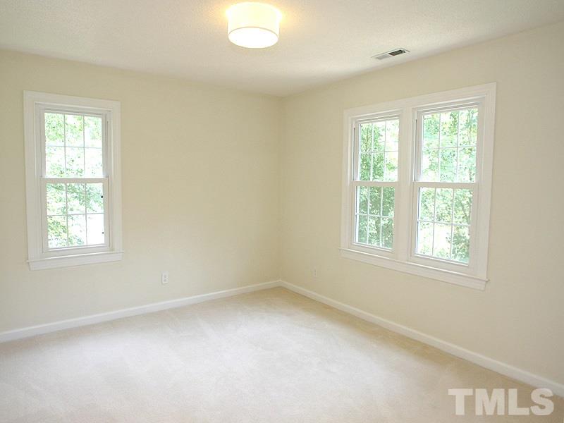 4 Swallows Ridge Court Durham, NC 27713 - Photo 15 of 18 an empty room with a window