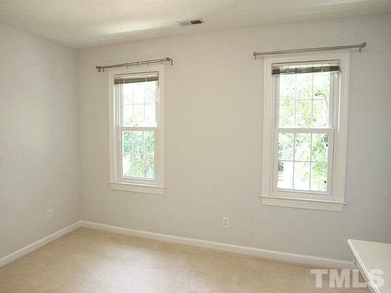 4 Swallows Ridge Court Durham, NC 27713 - Photo 16 of 18 an empty room with a window