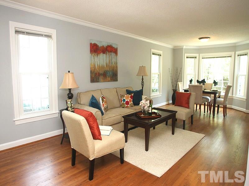 4 Swallows Ridge Court Durham, NC 27713 - Photo 4 of 18 a living room with furniture a table and a window