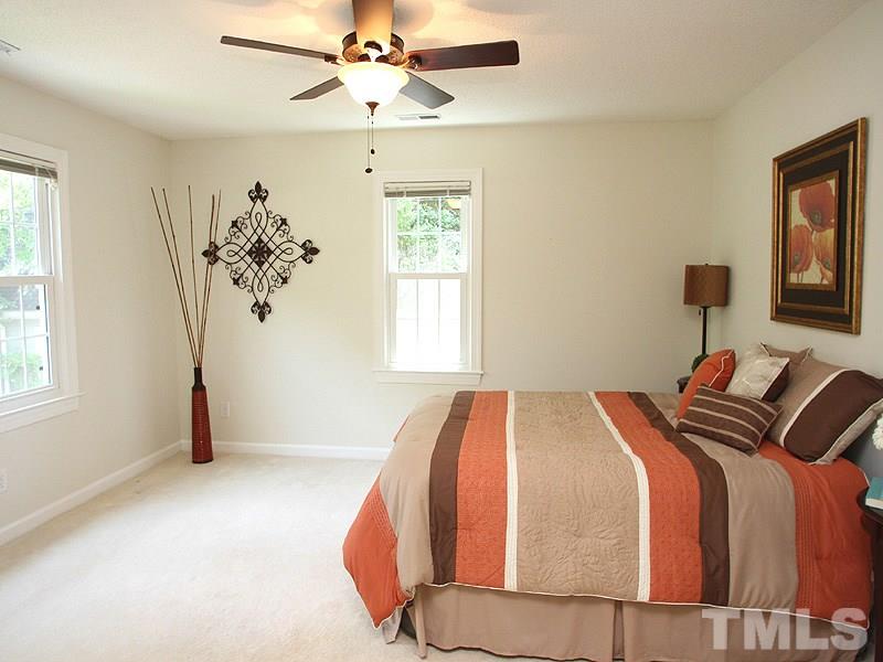4 Swallows Ridge Court Durham, NC 27713 - Photo 9 of 18 a bedroom with double bed and a window