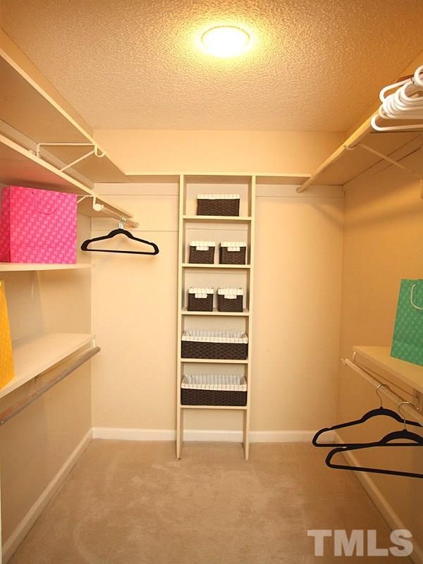 4 Swallows Ridge Court Durham, NC 27713 - Photo 10 of 18 a view of walk in closet with empty racks