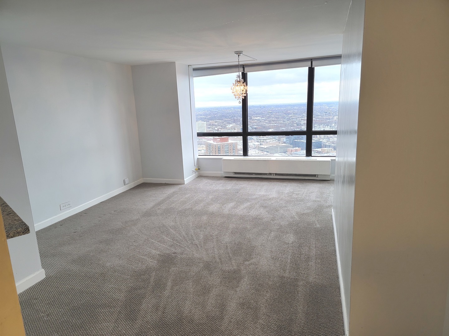 5415 North Sheridan Road, Unit 4503 Chicago, IL 60640 - Photo 3 of 19 a view of an empty room with a window