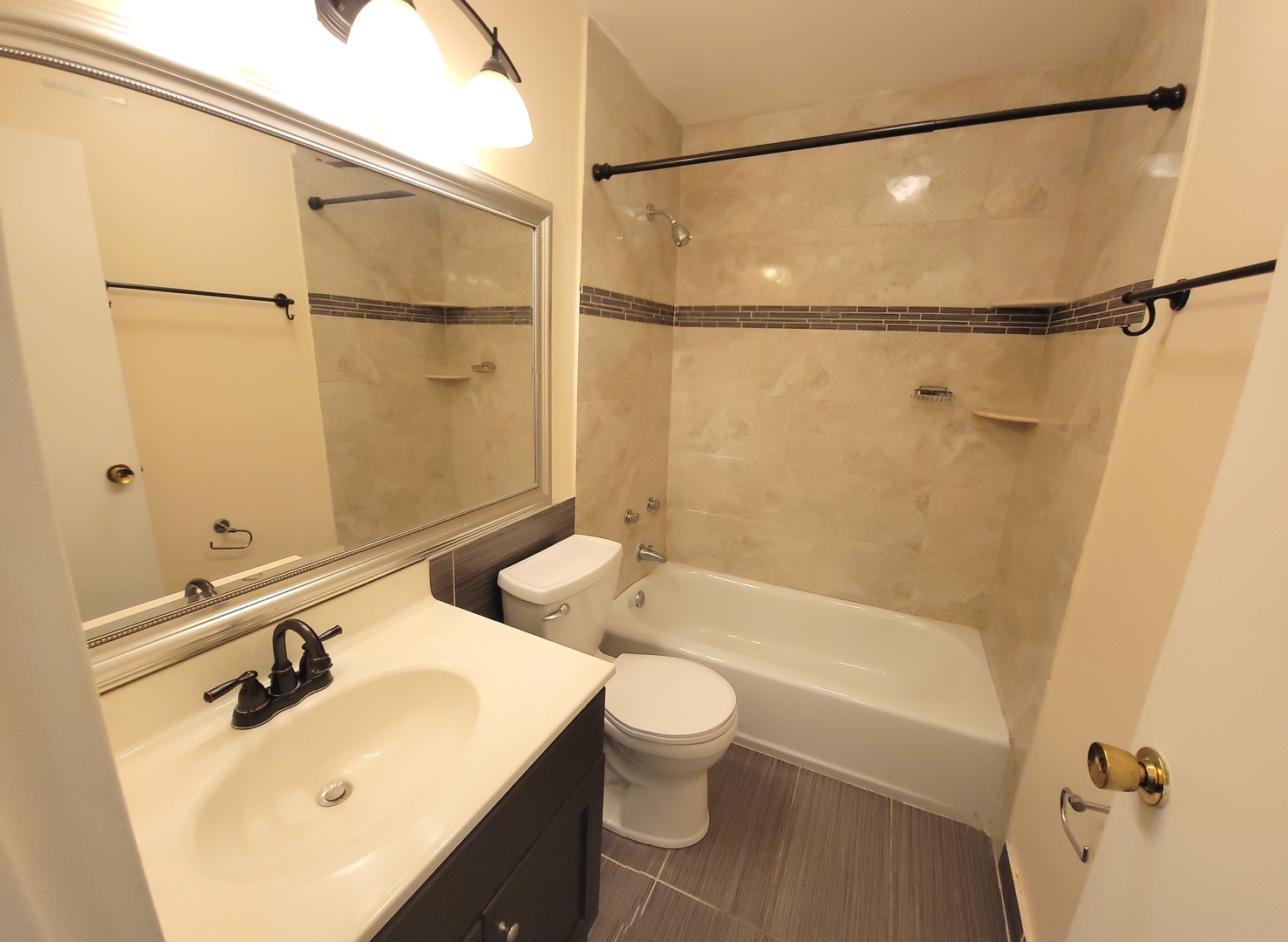 5415 North Sheridan Road, Unit 4503 Chicago, IL 60640 - Photo 10 of 19 a bathroom with a sink mirror toilet and bathtub