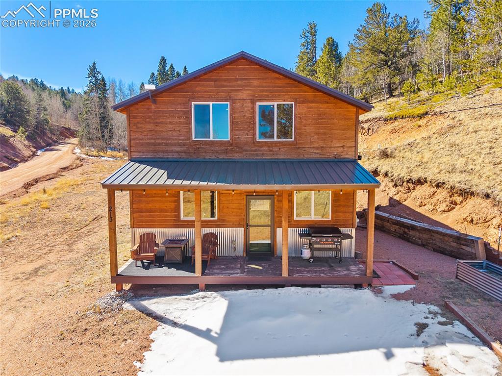 213 Willow Road Divide, CO 80814 - Photo 37 of 49 a view of a house with backyard and sitting area
