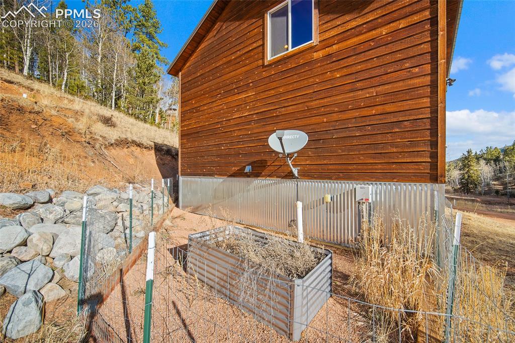 213 Willow Road Divide, CO 80814 - Photo 40 of 49 a front view of a house with a yard