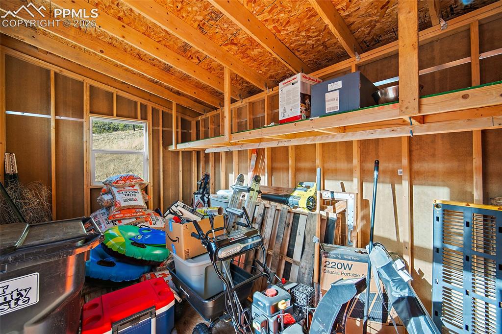 213 Willow Road Divide, CO 80814 - Photo 42 of 49 a room with lots of furniture and wooden floor