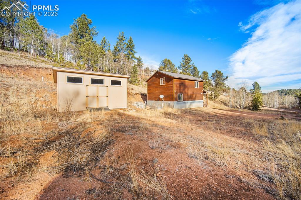 213 Willow Road Divide, CO 80814 - Photo 43 of 49 a view of a house with a yard