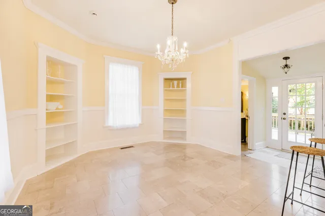 a kitchen with granite countertop cabinets stainless steel appliances and wooden floor