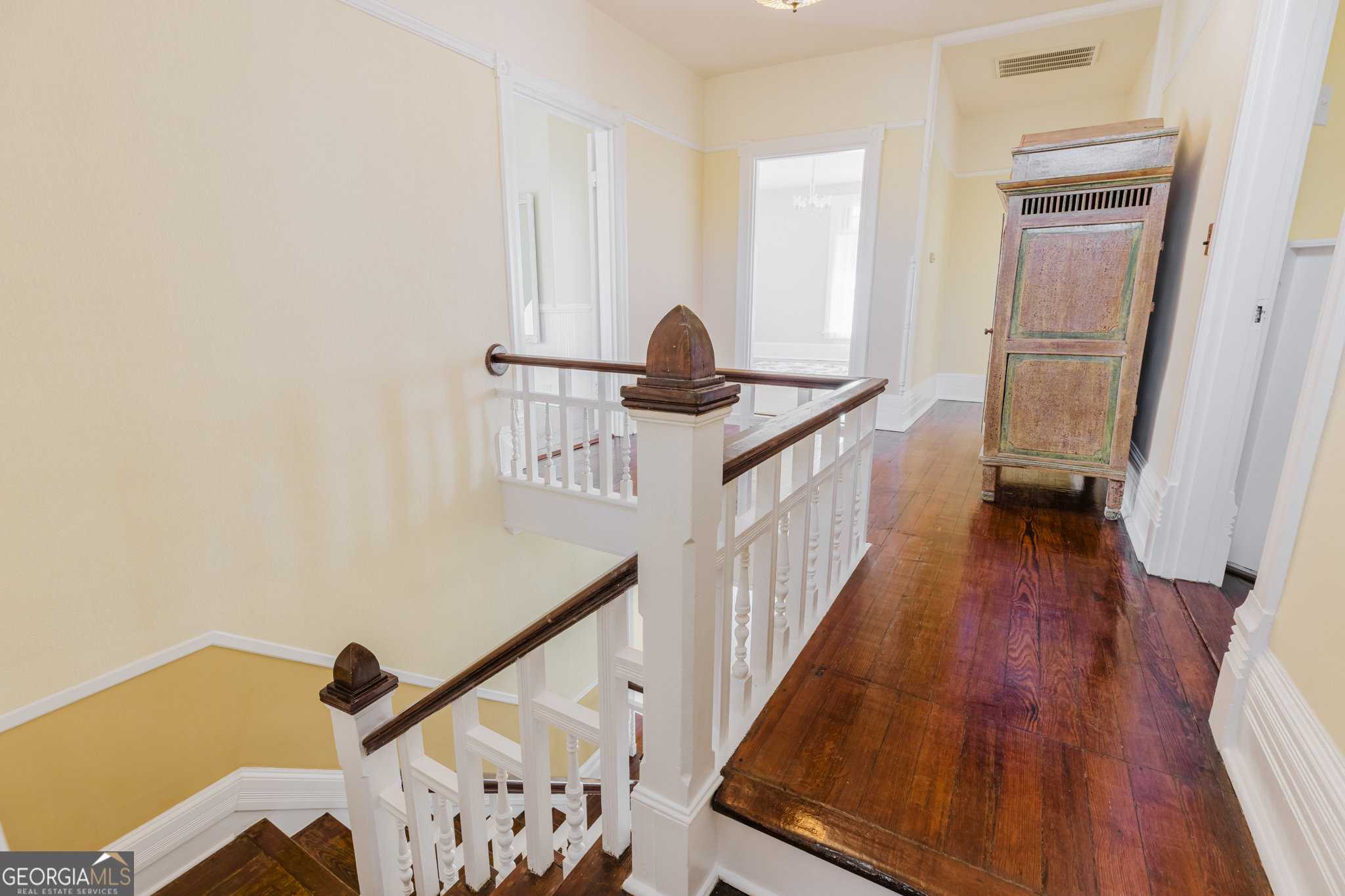 1202 South Lee Street Americus, GA 31709 - Photo 26 of 54 a view of hallway with wooden floor