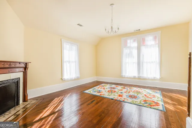 a view of hallway with wooden floor