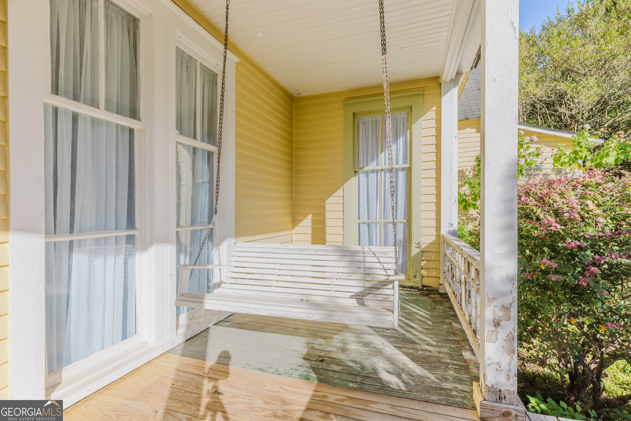 1202 South Lee Street Americus, GA 31709 - Photo 42 of 54 a view of a balcony with wooden floor and floor to ceiling window