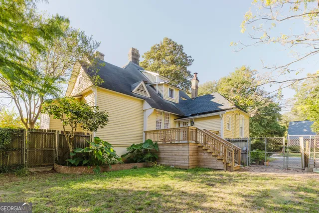 a view of balcony with wooden floor and fence