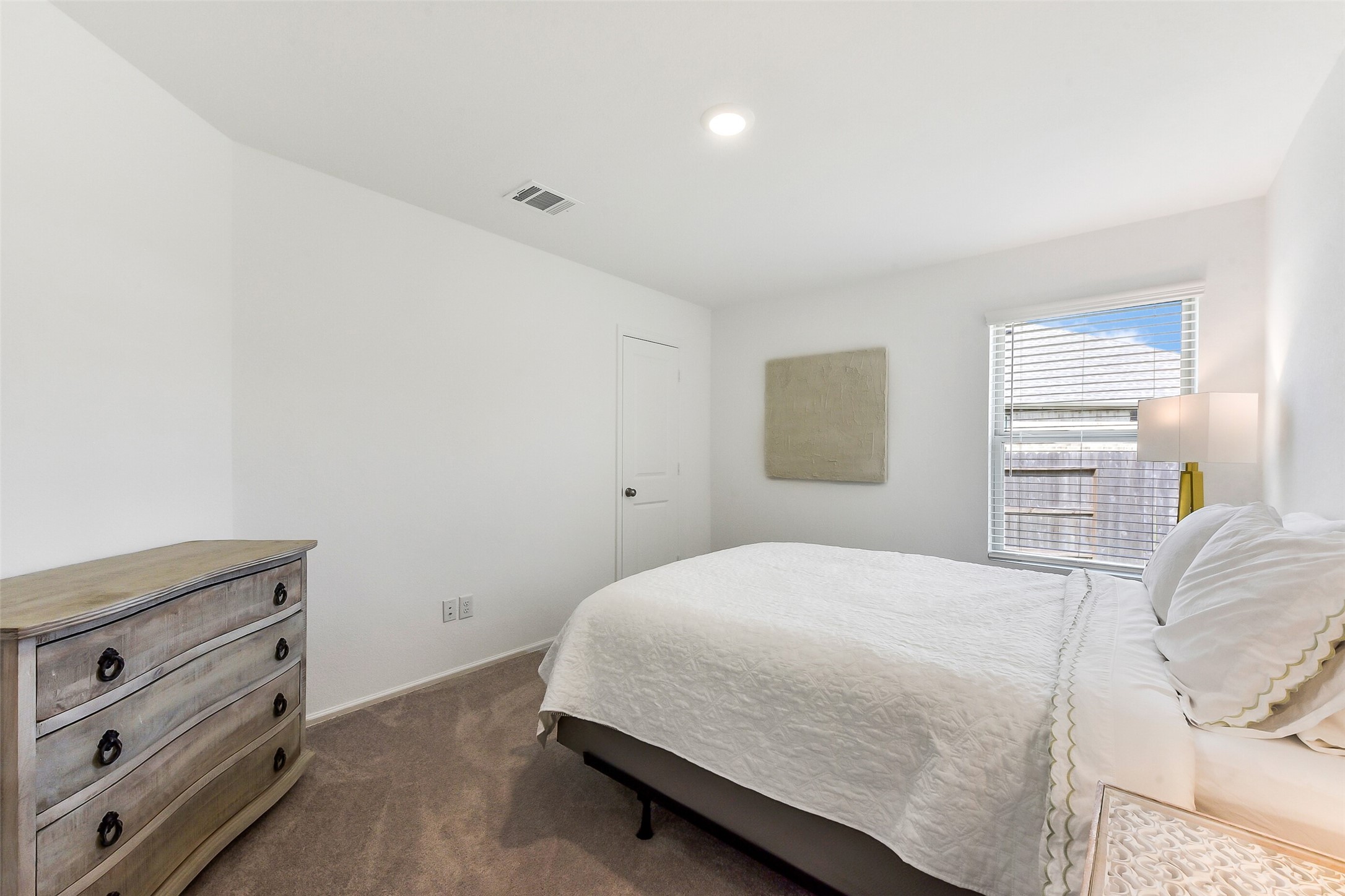 3003 Marble Rise Trail Kingwood, TX 77365 - Photo 14 of 25 a bedroom with a bed and a dresser