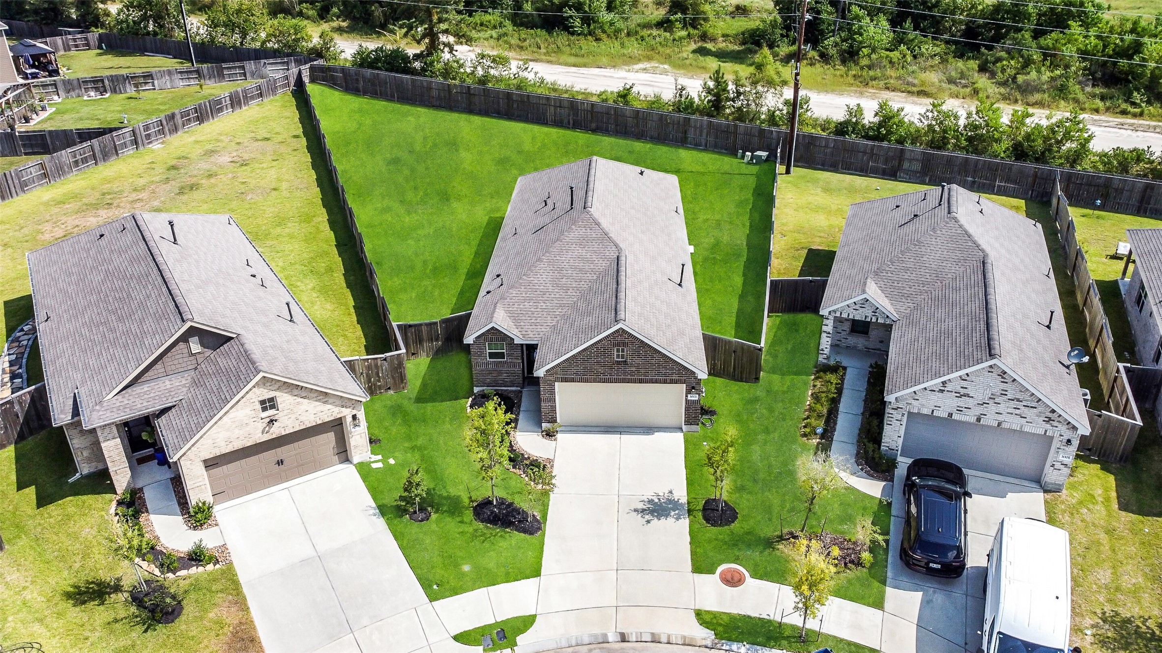 3003 Marble Rise Trail Kingwood, TX 77365 - Photo 24 of 25 an aerial view of a house with a garden and swimming pool