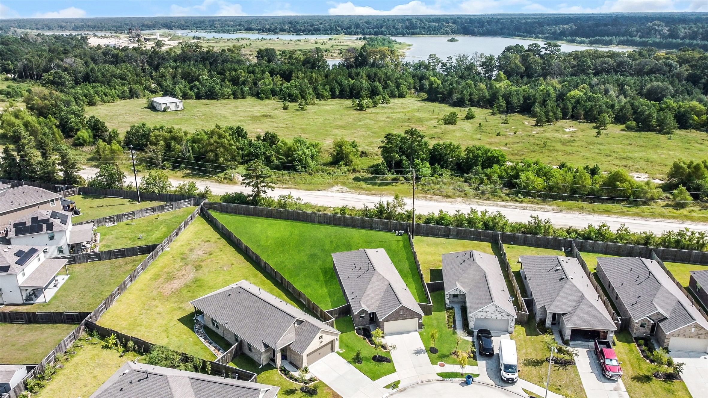 3003 Marble Rise Trail Kingwood, TX 77365 - Photo 3 of 25 a view of a lake with a house
