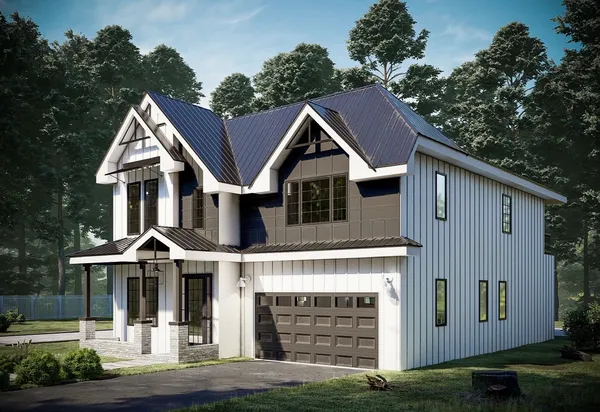 a front view of a house with yard and garage