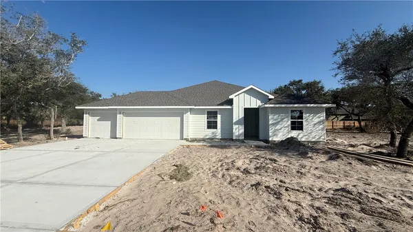 front view of a house with a trees