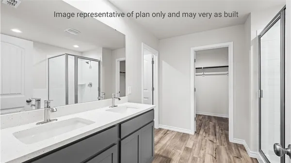 a bathroom with a double vanity sink and mirror