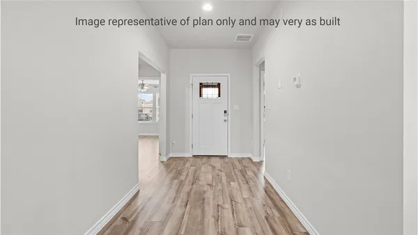 a view of a room with wooden floor and staircase