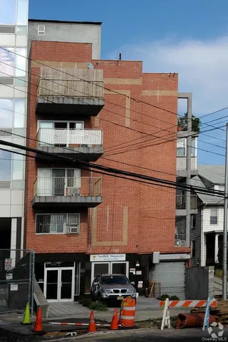 a front view of a building with glass windows