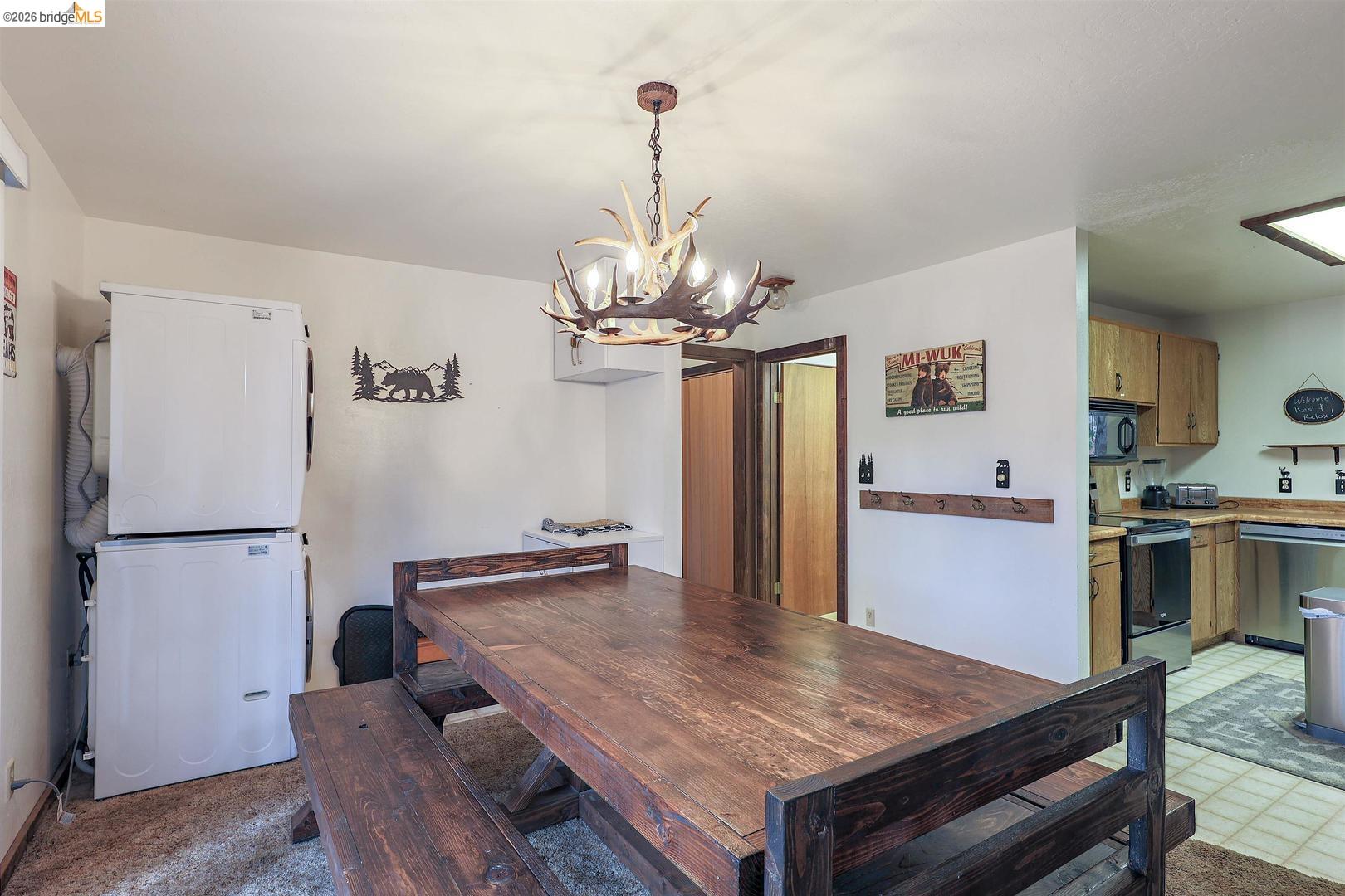 26600 Inyo Drive Cold Springs, CA 95335 - Photo 15 of 38 a kitchen with a table and refrigerator