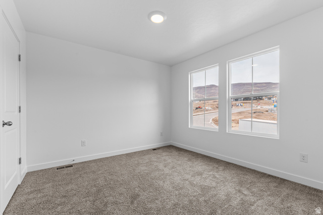 2829 South 710th West, Unit 17 Logan, UT 84321 - Photo 21 of 22 Carpeted spare room with baseboards
