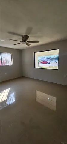 a view of an empty room with windows