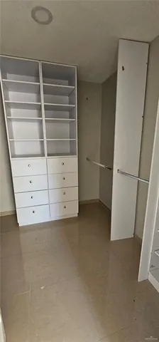 a view of an empty walk in closet