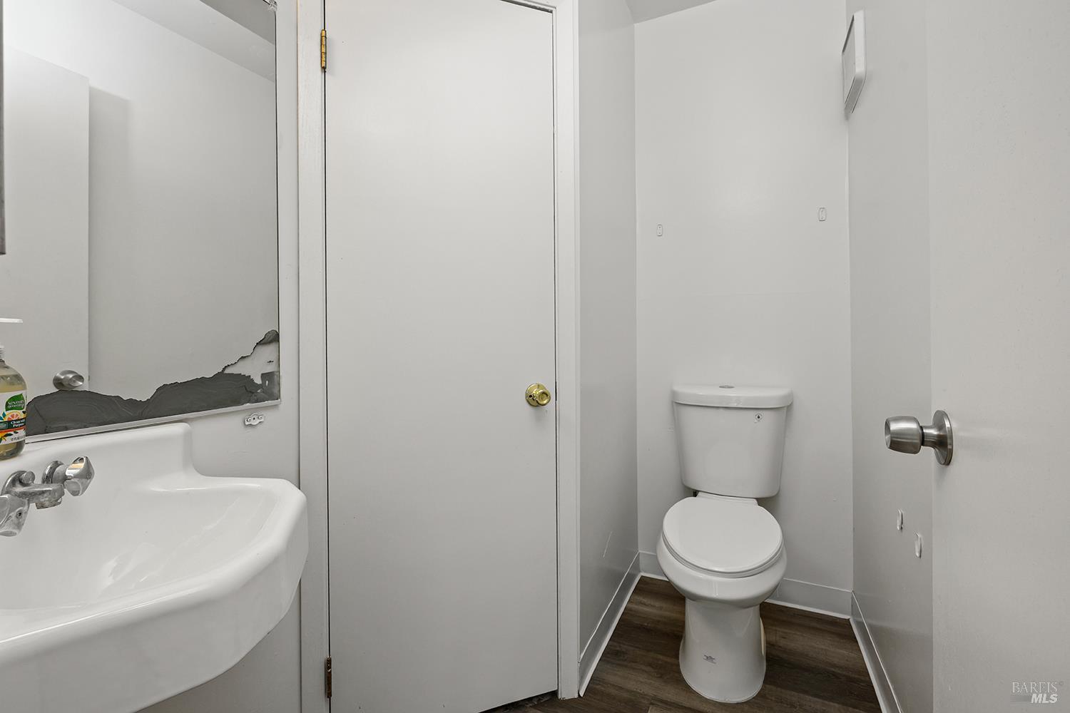 2125 West Steele Lane Santa Rosa, CA 95403 - Photo 10 of 30 The half bathroom on the main floor boasts an extra storage closet
