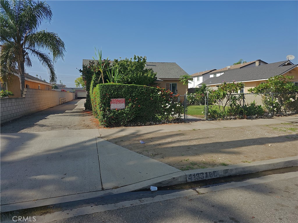 4133 Downing Avenue, Unit B Baldwin Park, CA 91706 - Photo 6 of 12 front view of house with a yard and palm trees