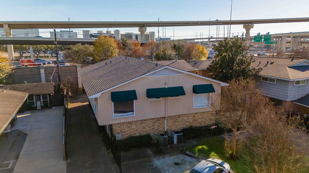 4723 Merwin Street Houston, TX 77027 - Photo 2 of 29 a balcony with table and chairs and potted plants