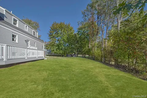 a view of a back yard of the house