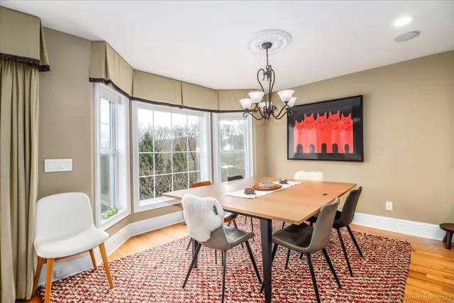 a view of a dining room with furniture window and outside view